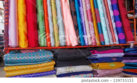 Mongolian traditional clothing (deel), colorful fabrics, Narantuul Market 139733151