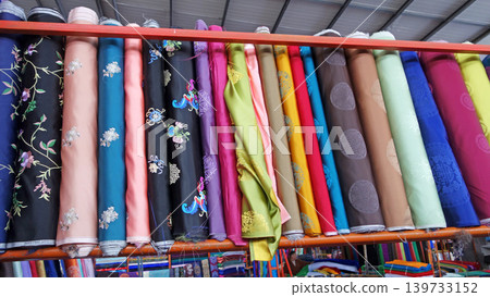 Mongolian traditional clothing (deel), colorful fabrics, Narantuul Market Mongolian traditional clothing (deel), colorful fabrics, Narantuul Market 139733152