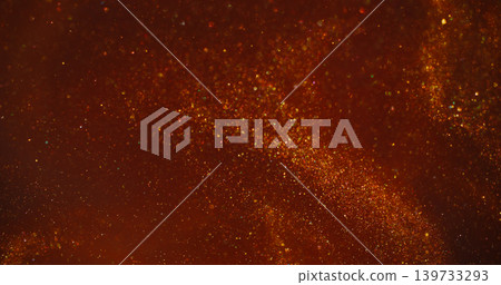 Defocused shimmering flow. Shiny particles glare. Red orange liquid powder mix flare. Color bokeh twinkle abstract art background. Defocused shimmering flow. Shiny particles glare. Red orange liquid powder mix flare. Color bokeh twinkle abstract art background. 139733293