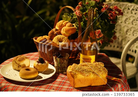 Still Life of Baked Goods and Flowers on Table 139733365