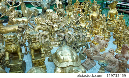 Tibetan Buddhist figurines on display in a Mongolian market: Narantuul Market, Ulaanbaatar Tibetan Buddhist figurines on display in a Mongolian market: Narantuul Market, Ulaanbaatar 139733469