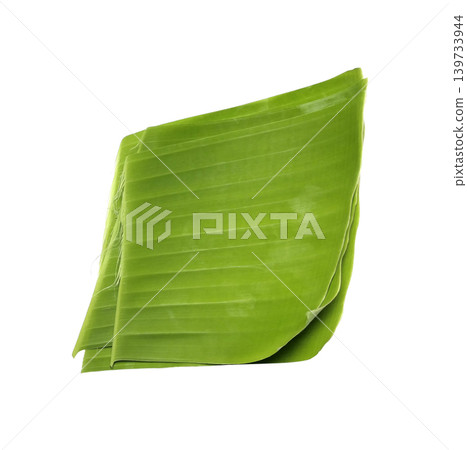 Pieces of green banana leaves are stacked on top of each other isolated on white background 139733944