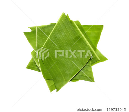 Pieces of green banana leaves are stacked on top of each other isolated on white background Pieces of green banana leaves are stacked on top of each other isolated on white background 139733945