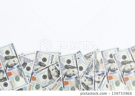 Isolated Scattered Hundred Dollar Bills Across White Background, Money Concept, Wealth, and Financial Abundance 139733968