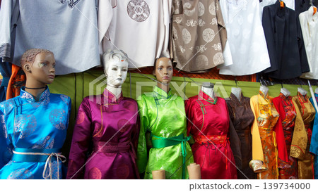 Mongolian traditional clothing, deel; colorful traditional clothing; Narantuul Market, Ulaanbaatar Mongolian traditional clothing, deel; colorful traditional clothing; Narantuul Market, Ulaanbaatar 139734000