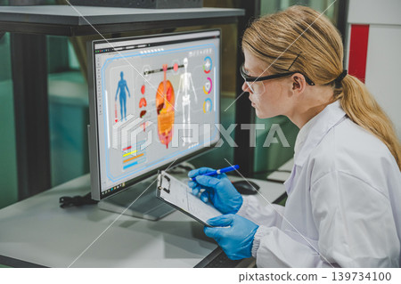 Female scientist analyzing human body data on screen using digital health monitoring system Female scientist analyzing human body data on screen using digital health monitoring system 139734100