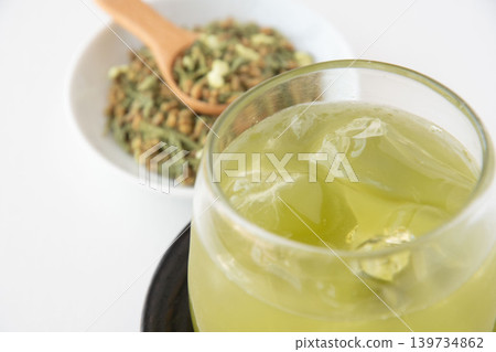 Cold matcha-infused brown rice tea Cold matcha-infused brown rice tea 139734862
