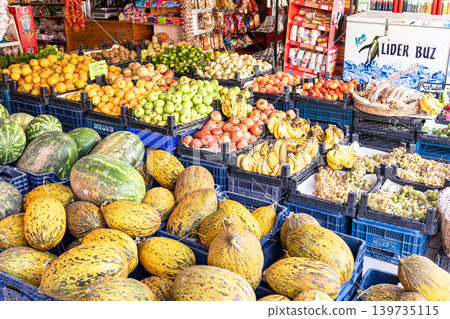 Colorful fruit market display with various fresh produce in baskets Colorful fruit market display with various fresh produce in baskets 139735115