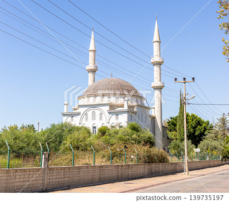 Mosque with two minarets and a large dome in suburban setting in Avsallar, Turkey, Mosque with two minarets and a large dome in suburban setting in Avsallar, Turkey, 139735197