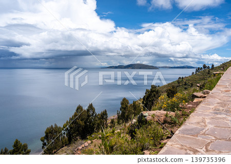 Stone path overlooking nature and terraces on Taquile Island, Lake Titicaca Stone path overlooking nature and terraces on Taquile Island, Lake Titicaca 139735396