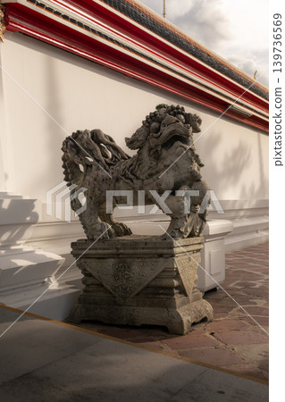 Historic Chinese stone lion statue, used as ship ballast in Rama III era, at Wat Pho temple. Historic Chinese stone lion statue, used as ship ballast in Rama III era, at Wat Pho temple. 139736569