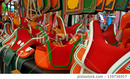 Traditional Mongolian horse tack and decorated saddles at Narantuul Market in Ulaanbaatar. Traditional Mongolian horse tack and decorated saddles at Narantuul Market in Ulaanbaatar. 139736957