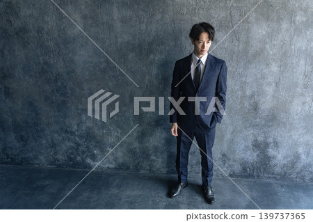 Portrait of a young male businessperson in a suit Portrait of a young male businessperson in a suit 139737365