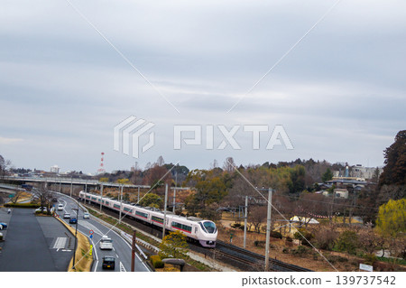 A Joban Line train passing by Mito Kairakuen Garden. A Joban Line train passing by Mito Kairakuen Garden. 139737542