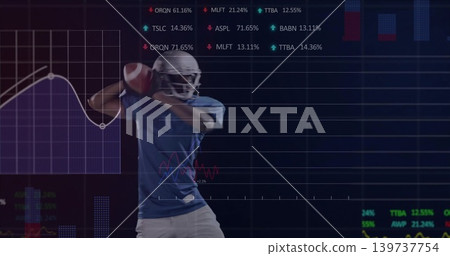 Preparing football player wearing white helmet holding ball near shoulder in studio, with analytics Preparing football player wearing white helmet holding ball near shoulder in studio, with analytics 139737754