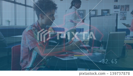 Reviewing man in plaid shirt using laptop, reading papers in open workspace with red chart 32 Reviewing man in plaid shirt using laptop, reading papers in open workspace with red chart 32 139737878