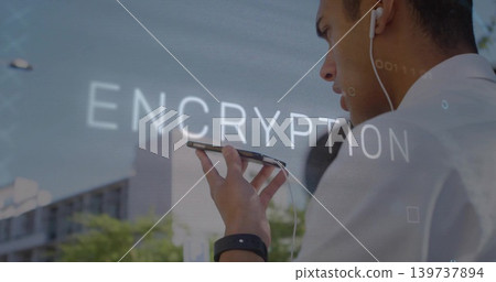 Speaking into phone man wearing collared shirt, wired earbud, watch, street ENCRYPTION, copy space Speaking into phone man wearing collared shirt, wired earbud, watch, street ENCRYPTION, copy space 139737894