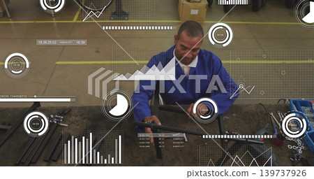 Repairing worker in blue jacket and tie aligning metal bar in workshop, with tools, HUD overlays Repairing worker in blue jacket and tie aligning metal bar in workshop, with tools, HUD overlays 139737926