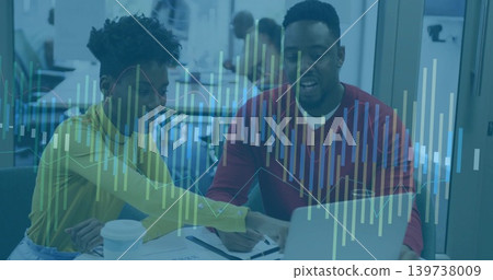 Collaborating team wearing yellow top and red sweater leaning over laptop in office data overlay Collaborating team wearing yellow top and red sweater leaning over laptop in office data overlay 139738009