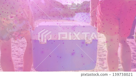 Holding portable cooler, two men wearing floral and coral swim shorts standing at sandy beach Holding portable cooler, two men wearing floral and coral swim shorts standing at sandy beach 139738021