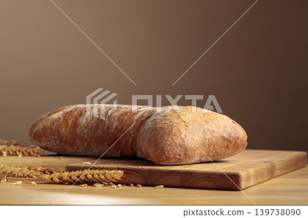 Fresh backed ciabatta bread on a wooden table. 139738090