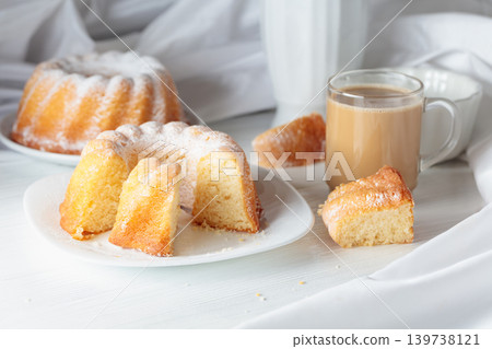 Easter cake and coffee latte on a white table. Easter cake and coffee latte on a white table. 139738121