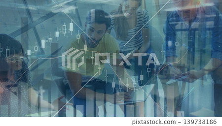 Analyzing team in casual clothing leaning at office with laptop, papers and financial charts Analyzing team in casual clothing leaning at office with laptop, papers and financial charts 139738186