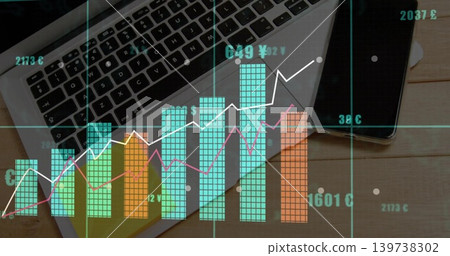 Displaying multicolored financial data visualization over work desk, with laptop and smartphone Displaying multicolored financial data visualization over work desk, with laptop and smartphone 139738302