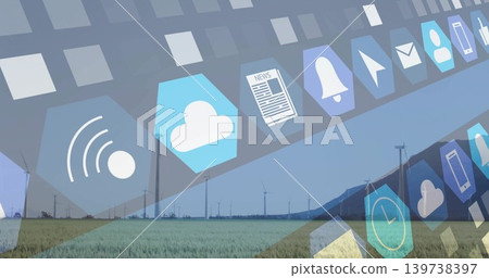 Displaying hexagon UI tiles across green field with wind turbines and low hills, showing icons Displaying hexagon UI tiles across green field with wind turbines and low hills, showing icons 139738397