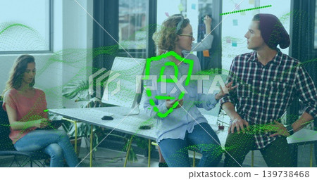 Talking woman with glasses in blue shirt leading meeting at open office with writable glass wall Talking woman with glasses in blue shirt leading meeting at open office with writable glass wall 139738468