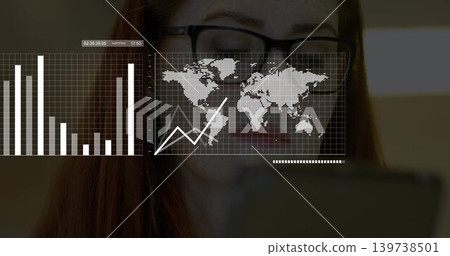 Analyzing woman studying data overlays at home desk, with rectangular glasses and handheld device 139738501
