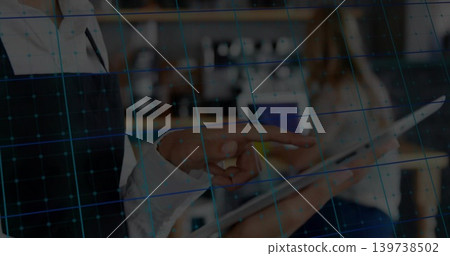 Pointing colleagues' hands in blazer and shirt using tablet at office counter, blue grid overlay Pointing colleagues' hands in blazer and shirt using tablet at office counter, blue grid overlay 139738502
