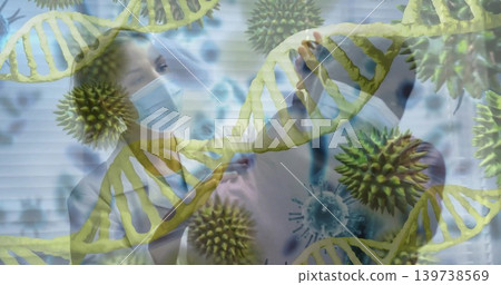 Two masked clinicians reviewing scans in clinic in lab coats with stethoscope, DNA virus blinds Two masked clinicians reviewing scans in clinic in lab coats with stethoscope, DNA virus blinds 139738569