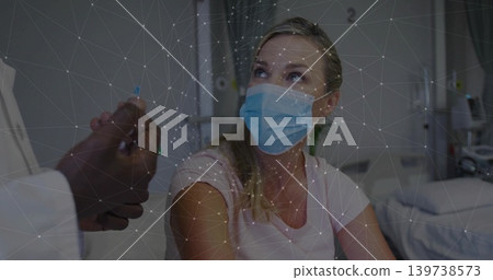 Looking up, patient wearing pink shirt, blue mask on hospital bed with doctor hand, network overlay Looking up, patient wearing pink shirt, blue mask on hospital bed with doctor hand, network overlay 139738573