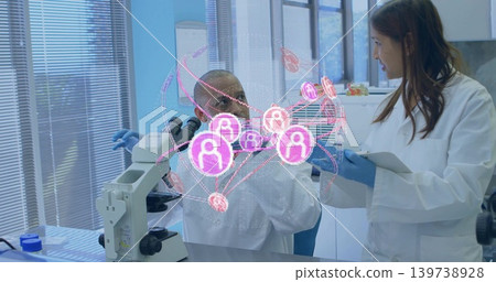 Analyzing 2 researchers working at lab bench with microscope AR overlay in white coats blue gloves Analyzing 2 researchers working at lab bench with microscope AR overlay in white coats blue gloves 139738928