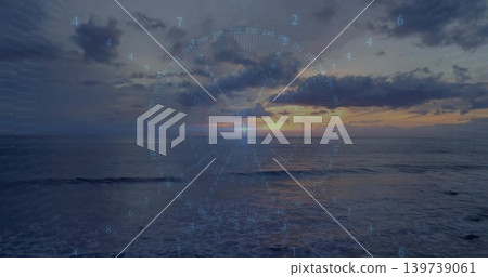 Glowing sun with centered HUD overlay reflecting on ocean at sunset, showing right coastline Glowing sun with centered HUD overlay reflecting on ocean at sunset, showing right coastline 139739061