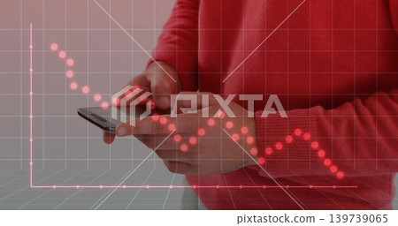 Hands and torso in red sweater holding, tapping phone against gray wall, 3D-grid red-chart overlay Hands and torso in red sweater holding, tapping phone against gray wall, 3D-grid red-chart overlay 139739065