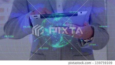 Presenter in gray suit jacket holding tablet in office, showing holographic globe, HUD, wristwatch 139739109
