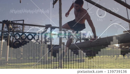 Vaulting shirtless athletic man clearing wooden beam at training park with tires, HUD overlay Vaulting shirtless athletic man clearing wooden beam at training park with tires, HUD overlay 139739136