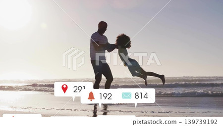 Swinging father in striped shirt holding daughter in light shorts at beach, with icons 29,192,814 Swinging father in striped shirt holding daughter in light shorts at beach, with icons 29,192,814 139739192