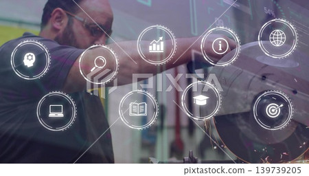 Guiding worker in dark polo, goggles, cutting metal at grinder at shop with HUD-icons and sparks Guiding worker in dark polo, goggles, cutting metal at grinder at shop with HUD-icons and sparks 139739205