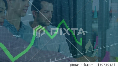 Analyzing team in collared shirts studying laptop at office with faint green line chart overlay 139739481