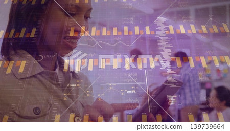 Analyzing woman in light collared jacket tapping tablet in office meeting with bar charts Analyzing woman in light collared jacket tapping tablet in office meeting with bar charts 139739664