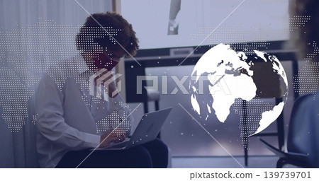Studying man in white shirt typing on laptop in conference room with globe overlay Studying man in white shirt typing on laptop in conference room with globe overlay 139739701