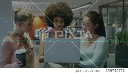 Working around laptop, women in open office viewing data overlay, in pink blouse holding coffee cup Working around laptop, women in open office viewing data overlay, in pink blouse holding coffee cup 139739752