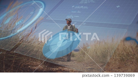 Walking adult male hiker wearing cap and backpack, navigating coastal trail with blue HUD graphics Walking adult male hiker wearing cap and backpack, navigating coastal trail with blue HUD graphics 139739869
