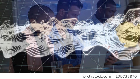 Reviewing team in business attire meeting in office, viewing laptop, papers, grid and waveform Reviewing team in business attire meeting in office, viewing laptop, papers, grid and waveform 139739870