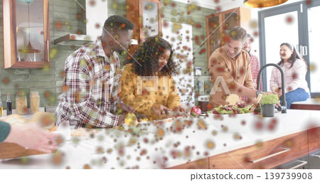 Preparing group in plaid shirt yellow sweater tan hoodie chopping at kitchen island with salad bowl Preparing group in plaid shirt yellow sweater tan hoodie chopping at kitchen island with salad bowl 139739908
