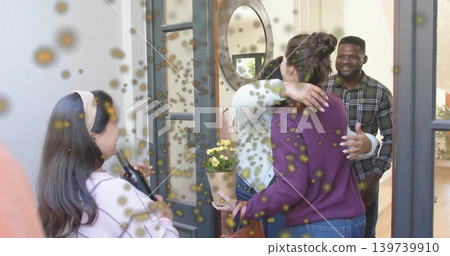 Hugging women wearing purple sweater and light knit at home entry, holding potted plant and handbag Hugging women wearing purple sweater and light knit at home entry, holding potted plant and handbag 139739910