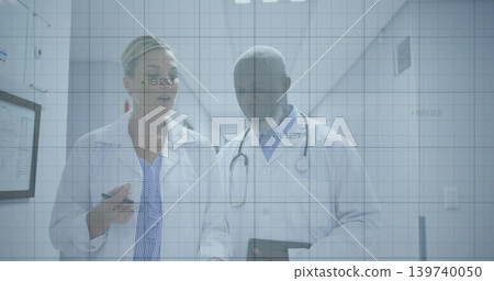 Walking doctors in labcoats using tablet in clinic hall, woman pointing pen, stethoscope, data grid Walking doctors in labcoats using tablet in clinic hall, woman pointing pen, stethoscope, data grid 139740050